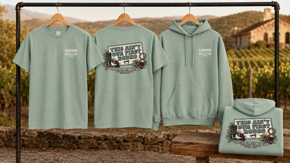 Custom printed tees and hoodies staged at an outdoor corporate retreat